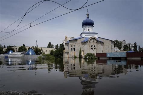 Families scramble for food and dry places to sleep after a dam collapses in Russian-occupied Ukraine
